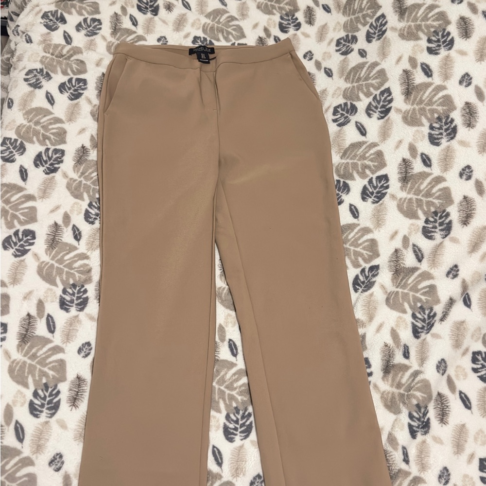 Rachel Zoe Tan and Black Garment